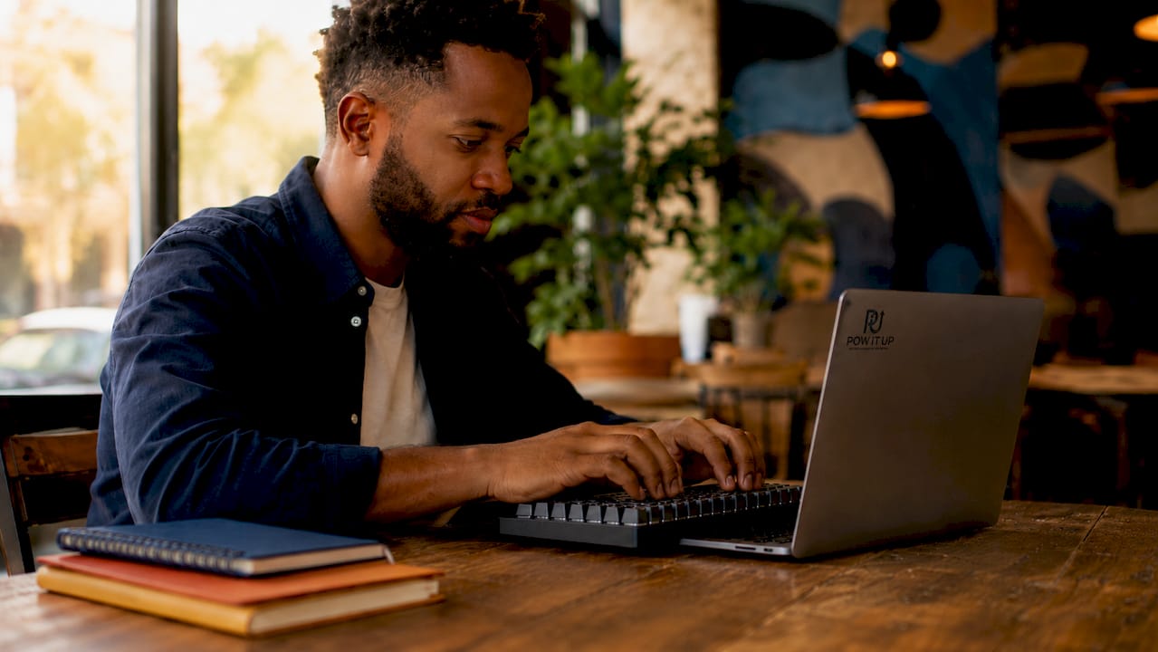 Hands typing beside AI orchestration software