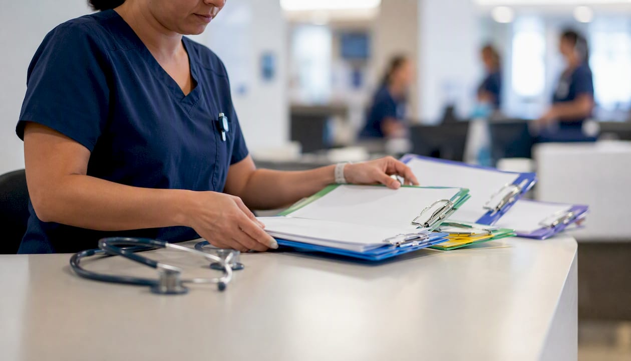 Nurse arranging workflow visual aids